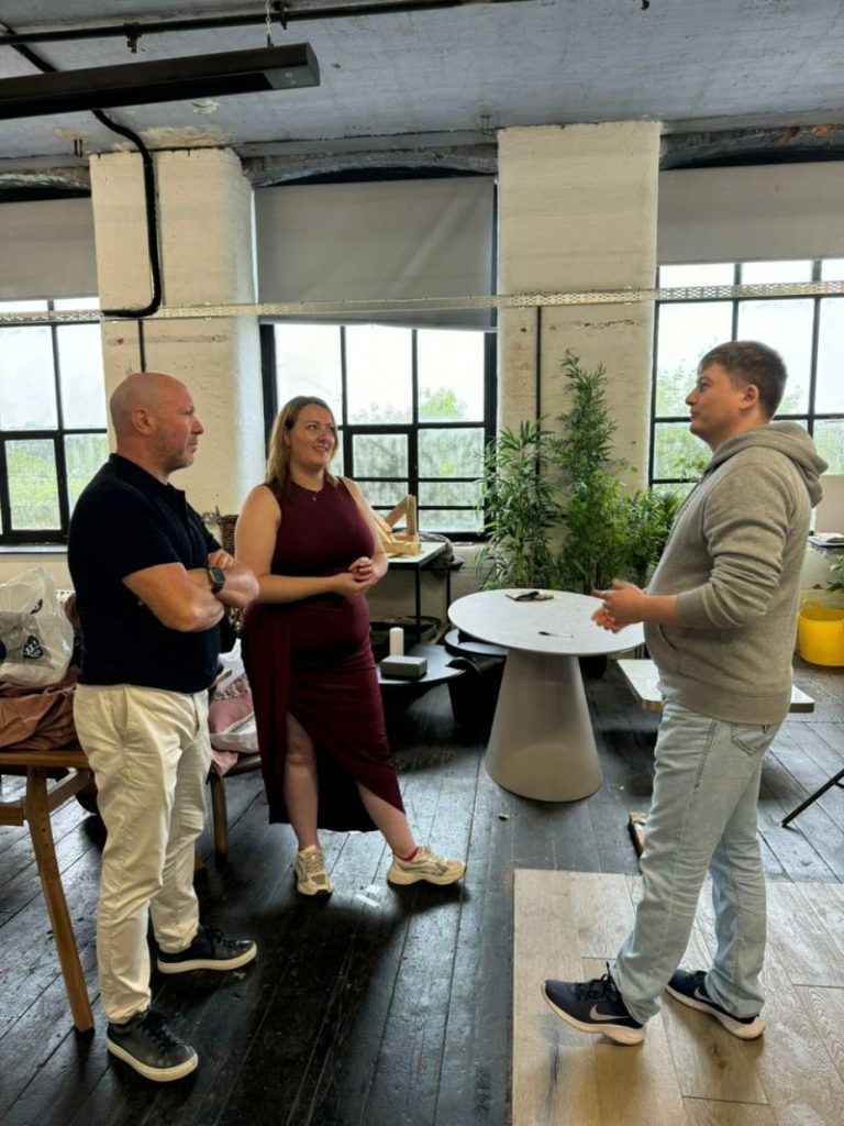 Paul Ryazanov in conversation with the Where Saints Go team during a customer visit
