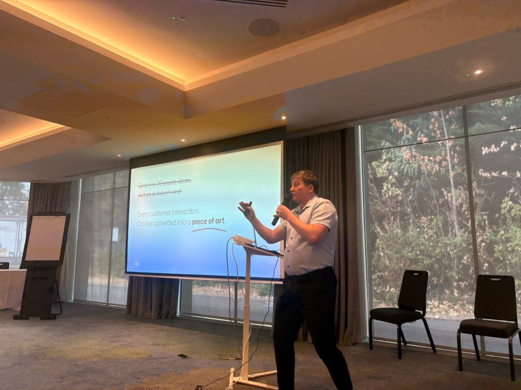 Paul Ryazanov presenting a slide about turning customer interactions into content